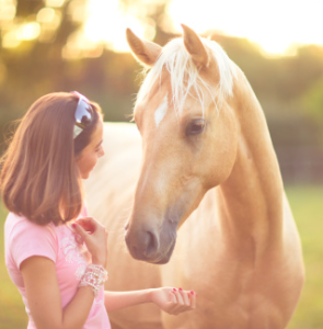 young girl with palomino
